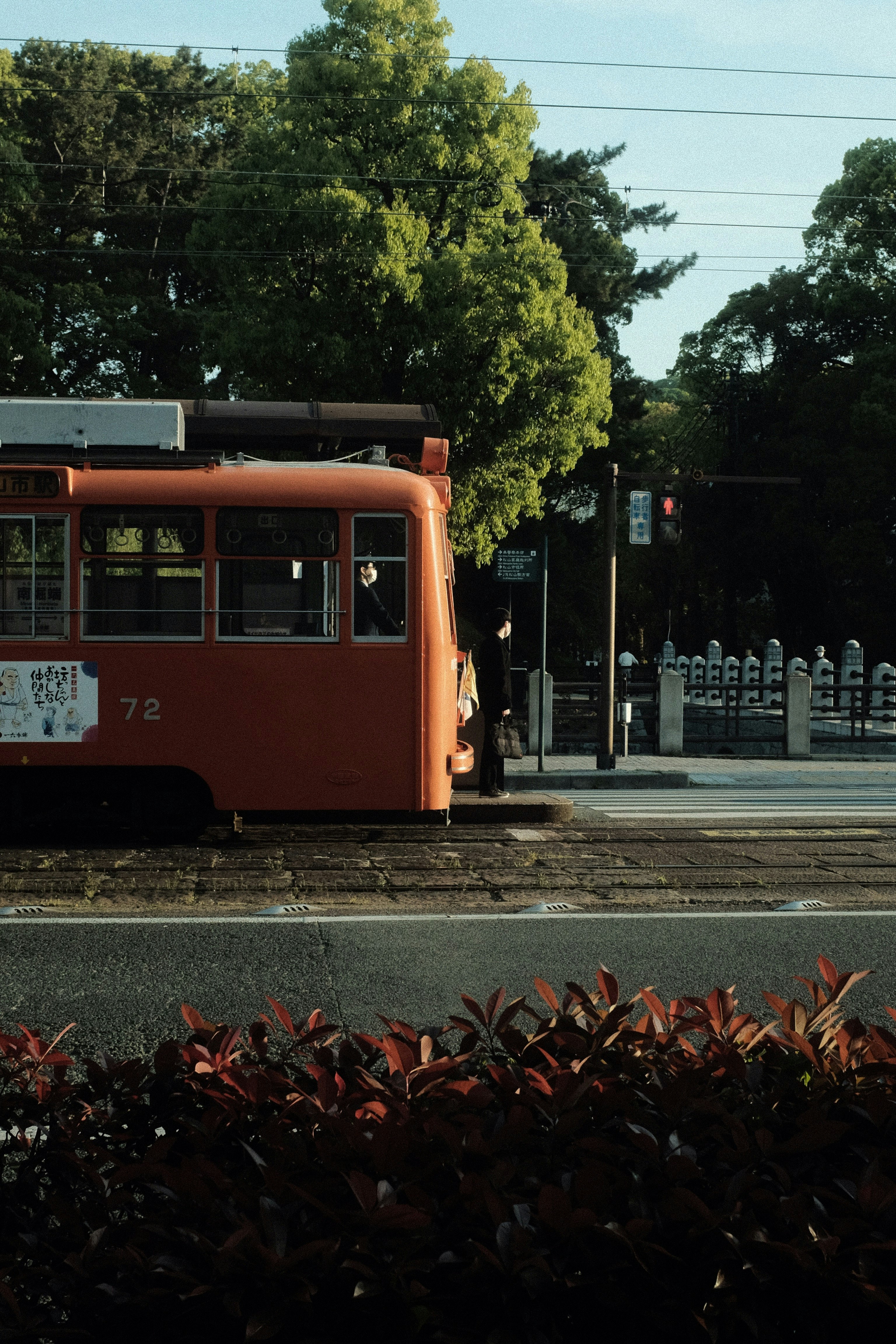 red and white tram on road during daytime